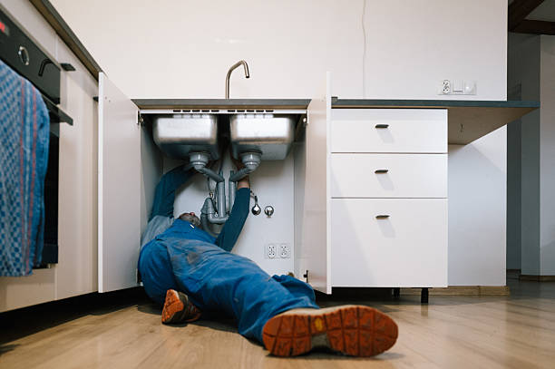 Professional Drain Cleaning technician working in Rogers, AR